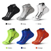 A variety of men's breathable mesh performance socks in black, grey, white, green, blue, and orange are displayed on a white 