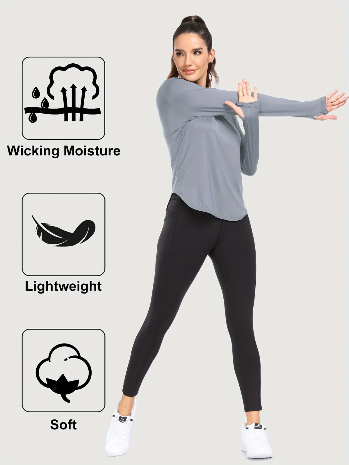 A woman models a gray loose fit sun protection t-shirt and black leggings, highlighting features like wicking moisture, light