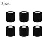 Five rolls of black tattoo grip bandage tape stacked horizontally.