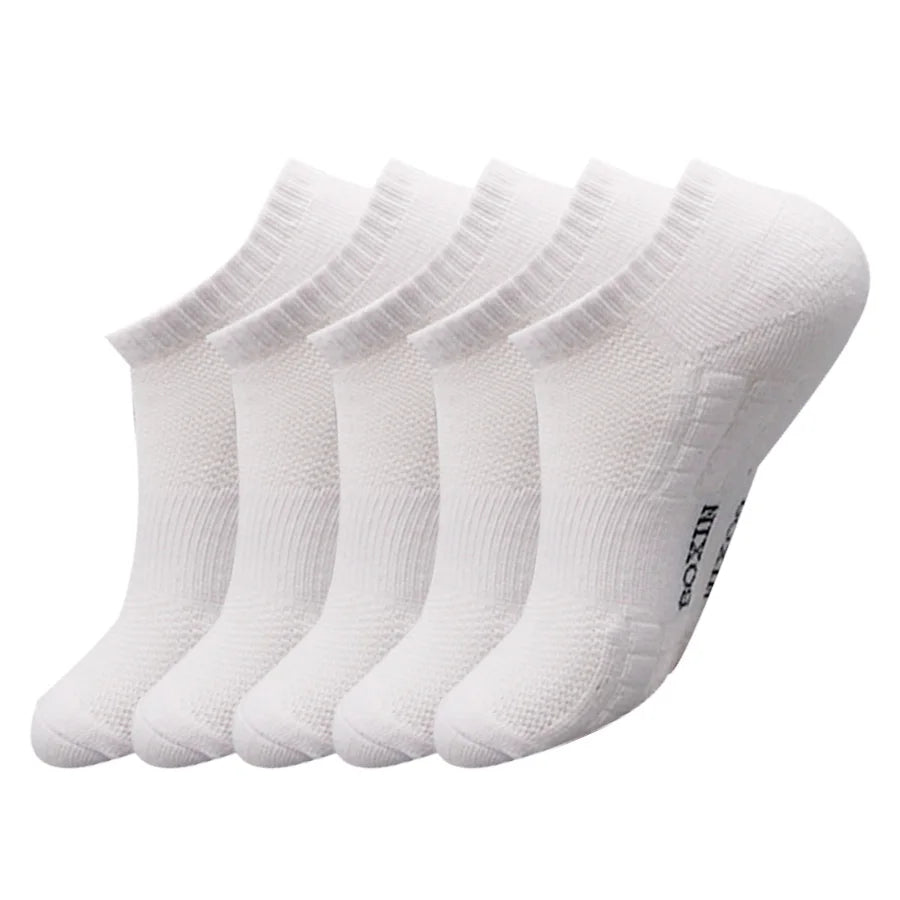 A set of white men's essential warm socks for outdoor activities, displayed in a row.