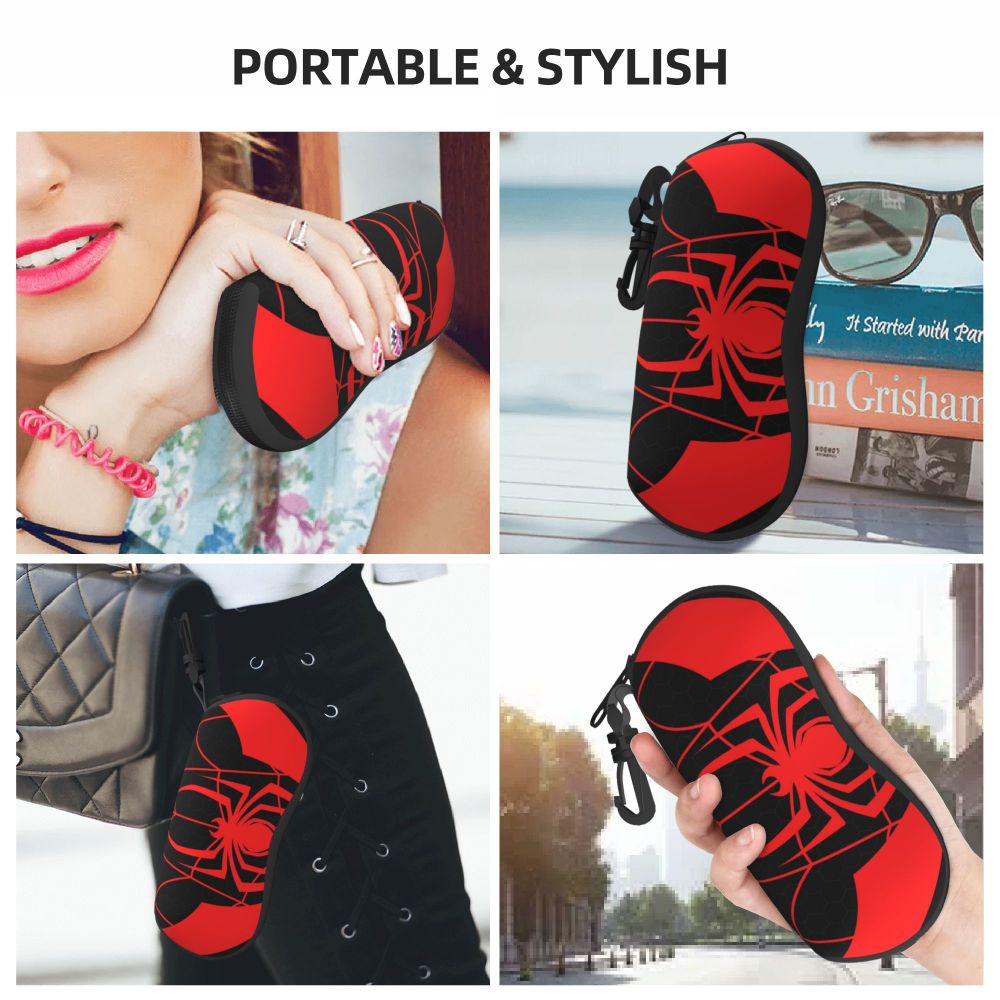 A black and red spider web patterned silicone pouch designed to hold eyeglasses.
