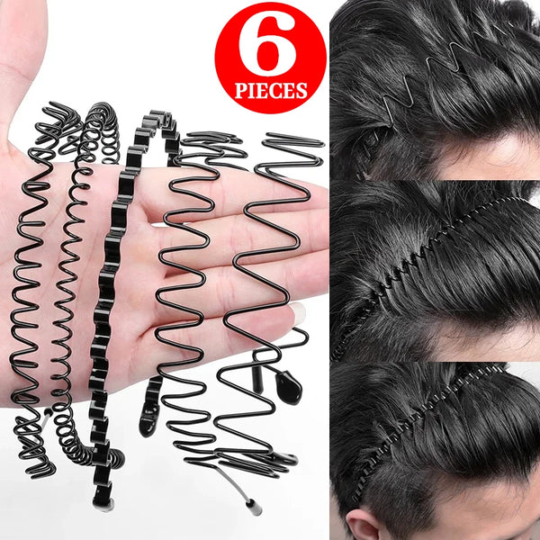 A hand displays six black metal hair bands coiled and laid out for sale.