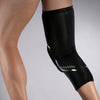 Black performance knee compression sleeve worn on a person's leg.