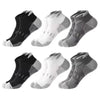 A pack of six athletic mesh ankle socks in black and white patterns displayed individually.