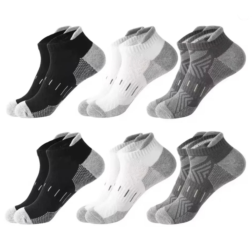 A pack of six athletic mesh ankle socks in black and white patterns displayed individually.