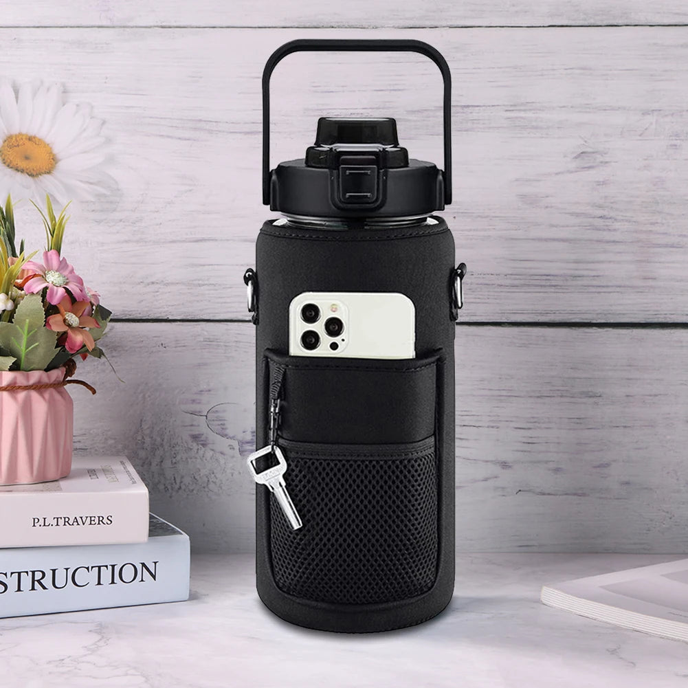 A black protective water bottle sleeve with a lid and a built-in phone holder is displayed on a white surface.