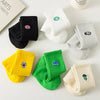 A collection of men's athletic embroidered crew socks in various colors including black, white, gray, yellow, and green.