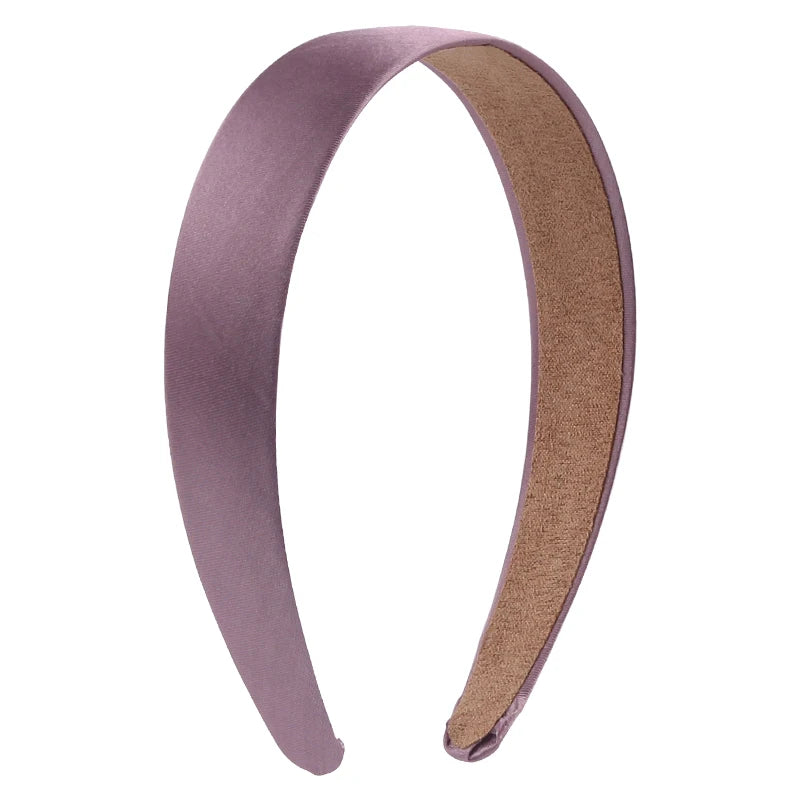 A pair of solid satin hair bands in mauve and brown.