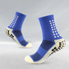 Un par de calcetines deportivos para fútbol azules y beige antideslizantes para hombres, vistos de lado.