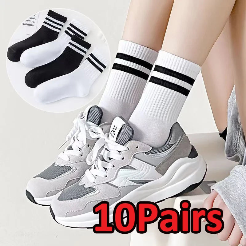 A pair of gray and white athletic shoes with black and white striped socks are shown, along with a circular inset displaying 