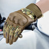 A hand wearing tactical PU leather cycling gloves with a camouflage pattern is shown in a close-up view.