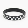 Black silicone wristband with a white checkered pattern.