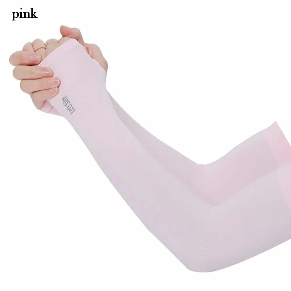 A hand is holding a light pink, long-sleeved arm sleeve for sun protection.