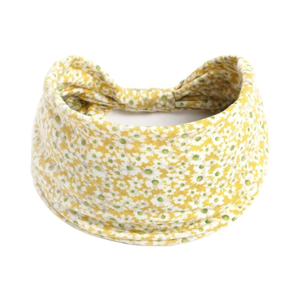 Large yellow bohemian print headband hair wrap tied in a bow.