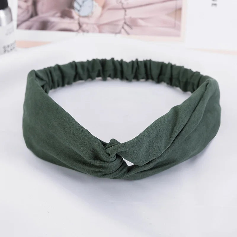 A dark olive green bohemian chiffon fabric headband tied in a knot, displayed on a white surface.
