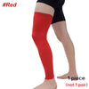 A full leg compression sleeve in red worn on a person's leg.