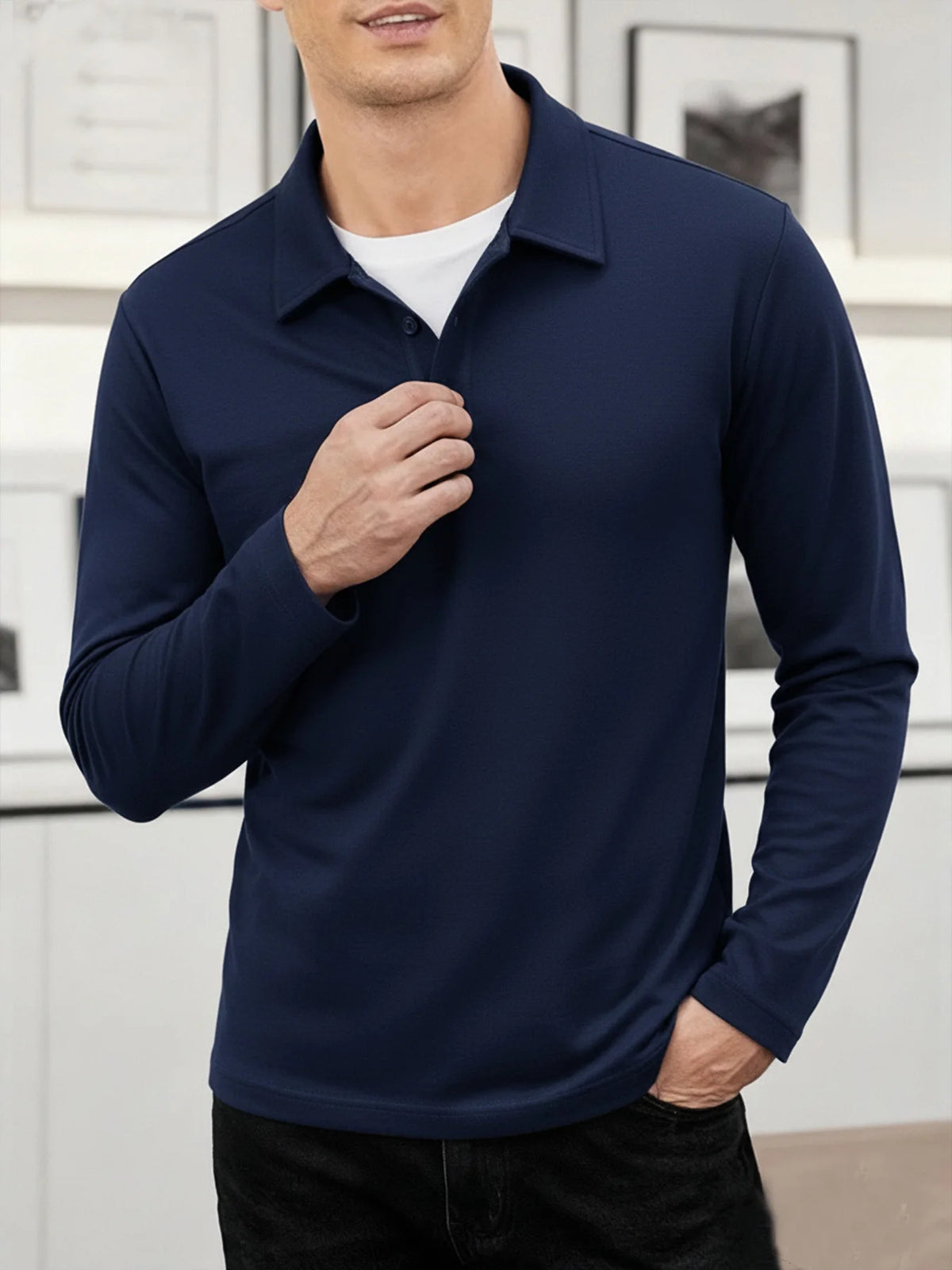 A man wearing a navy blue breathable casual polo shirt and dark pants.