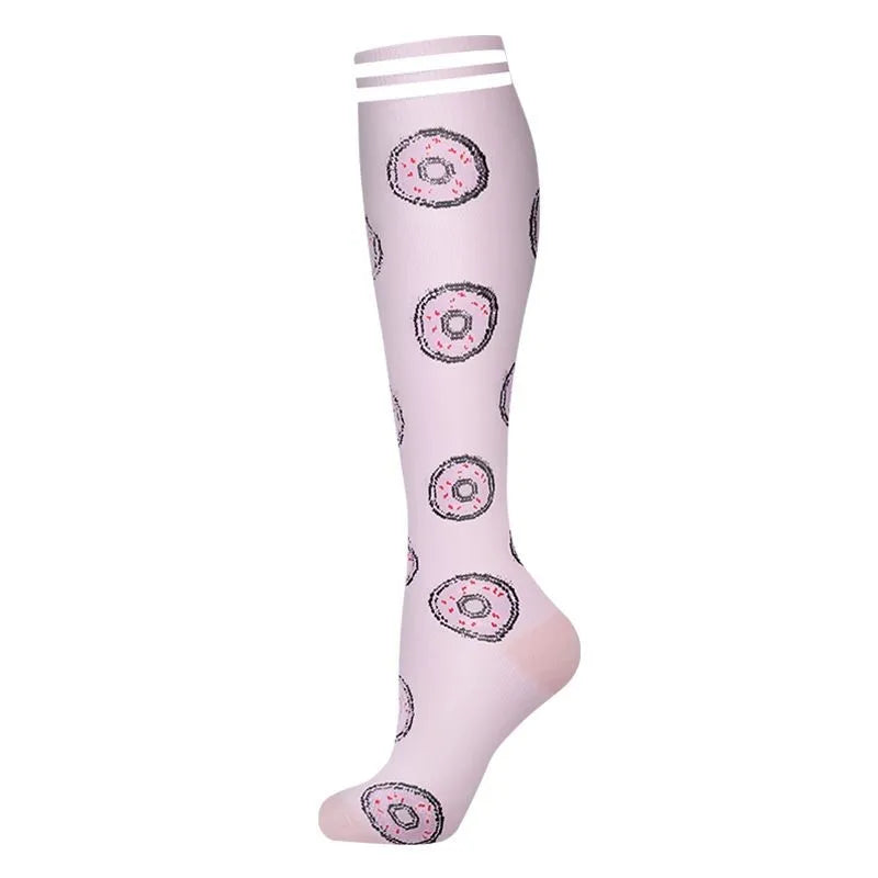 A pair of light pink compression socks with a patterned design.