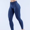 Legging de yoga sin costuras de color azul marino oscuro de talle alto usado por una persona.