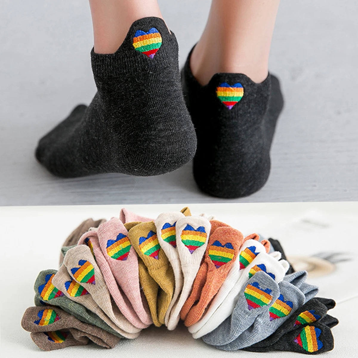 A stack of colorful embroidered ankle socks in various shades of pink, yellow, green, and purple.