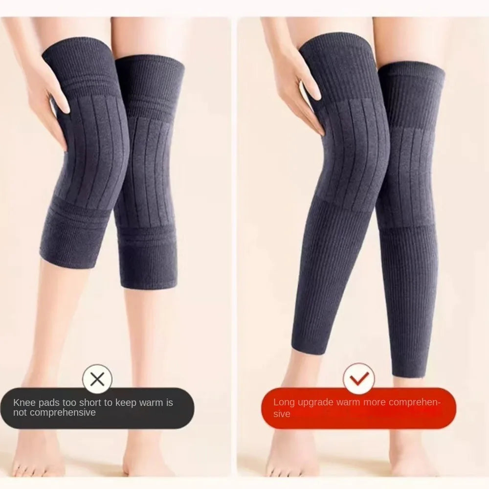 A pair of dark gray thick wool knee warmers and leg guards shown on a model's legs.