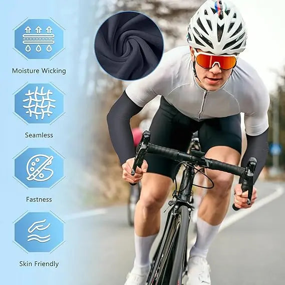 Un cycliste portant des vêtements anti-transpiration noirs et des lunettes orange, faisant du vélo sur une route.