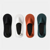 Four pairs of men's invisible boat socks in black, white, burnt orange, and dark teal shown from the top view.