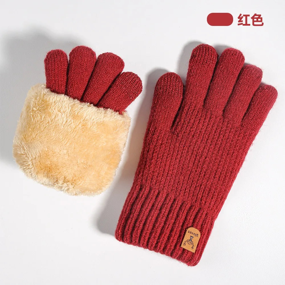 A pair of deep red knit gloves with fuzzy cuffs and textured fingers shown against a white background.