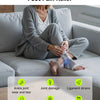 A person is sitting on a couch wearing blue foot pain relief socks while relaxing.