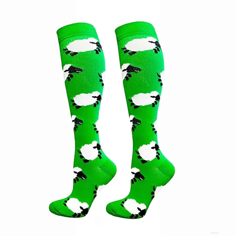 Pair of bright green compression elastic socks with a black and white cow print pattern