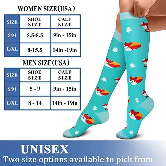 A pair of green compression socks with red and white designs shown on a person's leg.