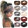 Colección de diademas de tela estampadas para fitness y yoga, incluyendo diseños de leopardo, floral y rayas