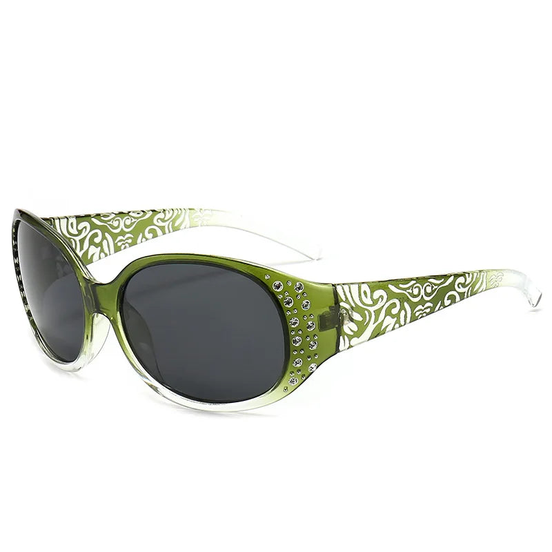 Green sunglasses with a leaf pattern and diamond-inlaid accents