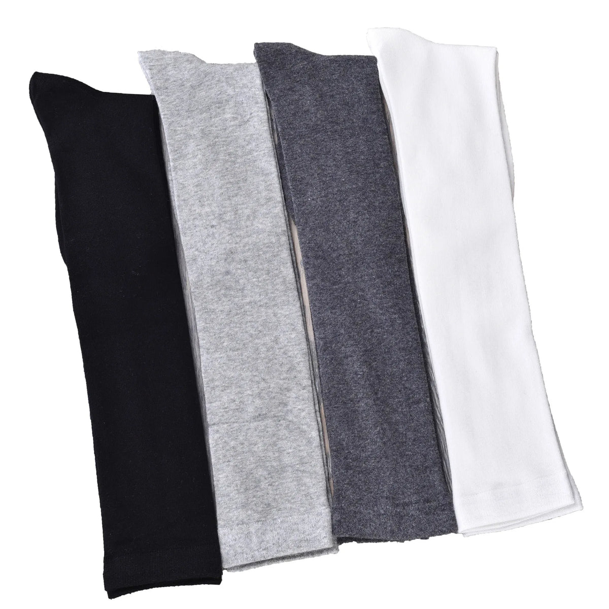 Un juego de tres calcetines hasta el muslo en negro, gris y blanco.