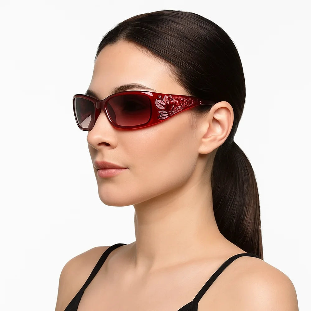 A close-up of a woman wearing red rhinestone Y2K cat eye sunglasses.