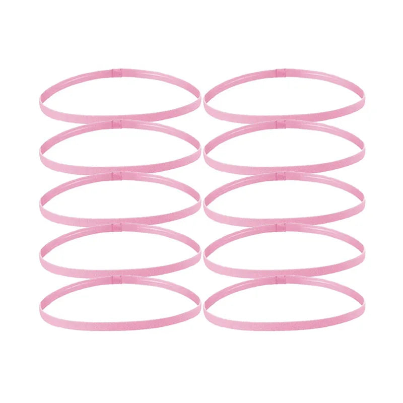 A set of five pink multi-functional elastic sports headbands laid out horizontally.
