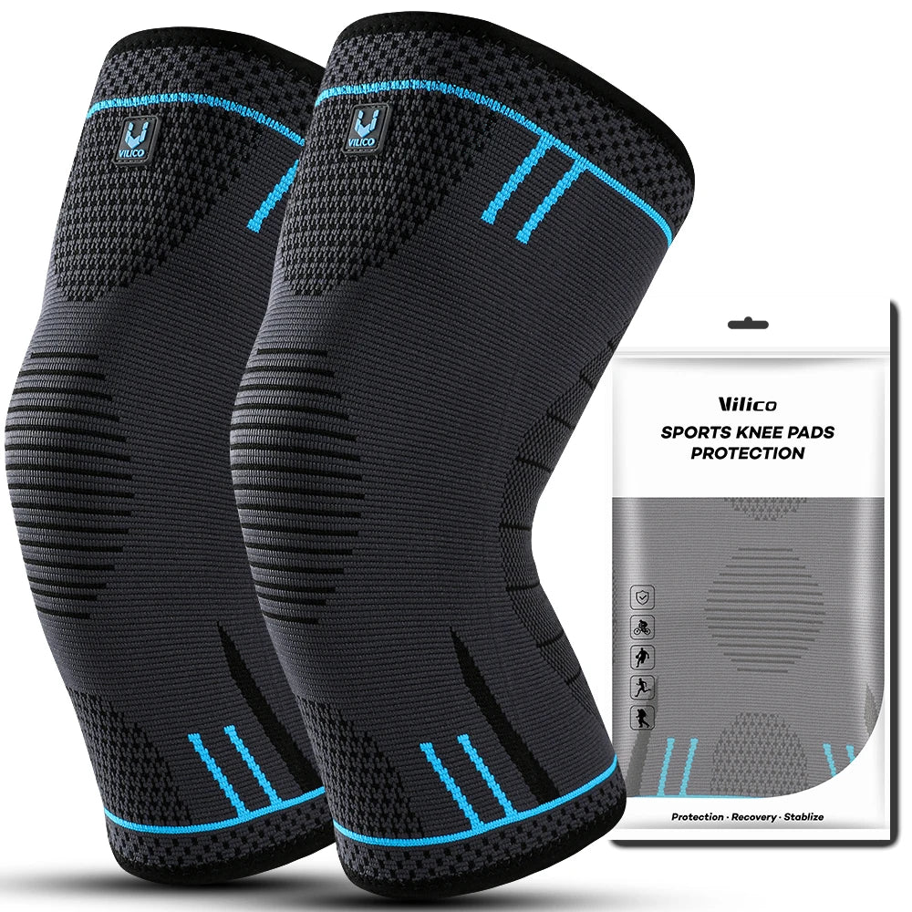 A pair of black compression knee pads with blue accents shown against a white background.