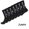 Two pairs of black non-slip grip socks for sports and activity