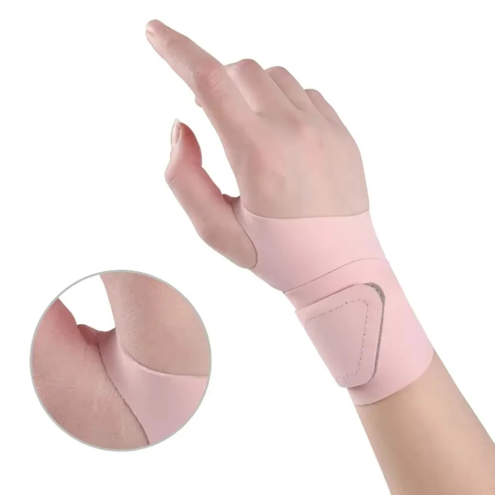 A hand wearing a pink breathable wrist guard for sports and fitness.