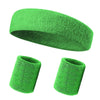A green knitted sports headband shown in both a rolled and unfolded form.