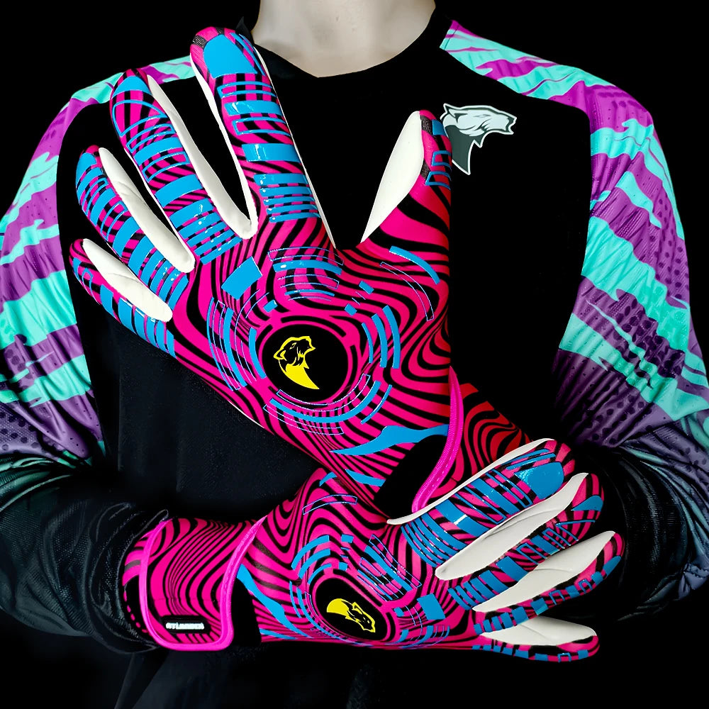 A pair of vibrant pink and cyan goalkeeper gloves worn on a hand against a dark background.
