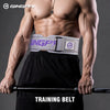 A muscular man wearing a gray training belt while holding a barbell for fitness training.