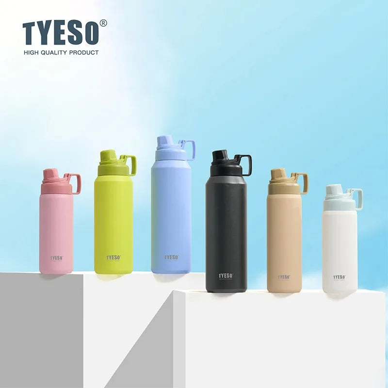 Une collection de cinq tasses thermos en acier inoxydable isothermes colorées, présentées sur une surface blanche.