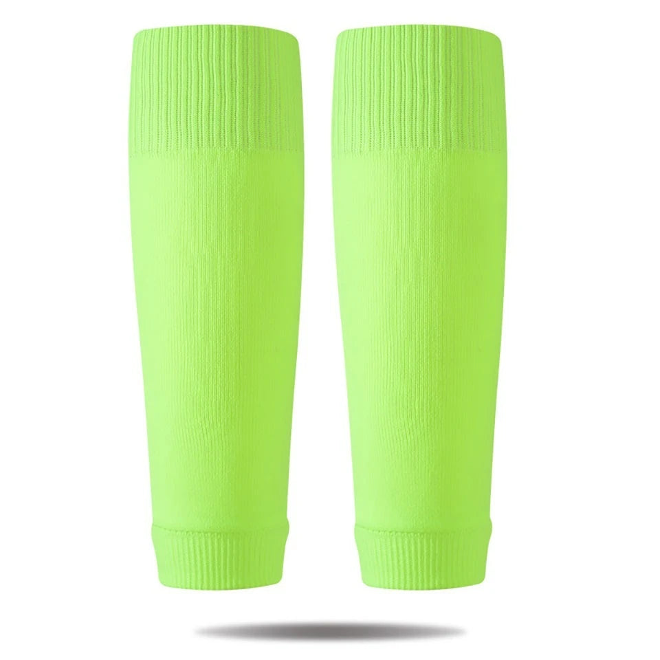 A pair of neon lime green compression sleeves for soccer and sports.