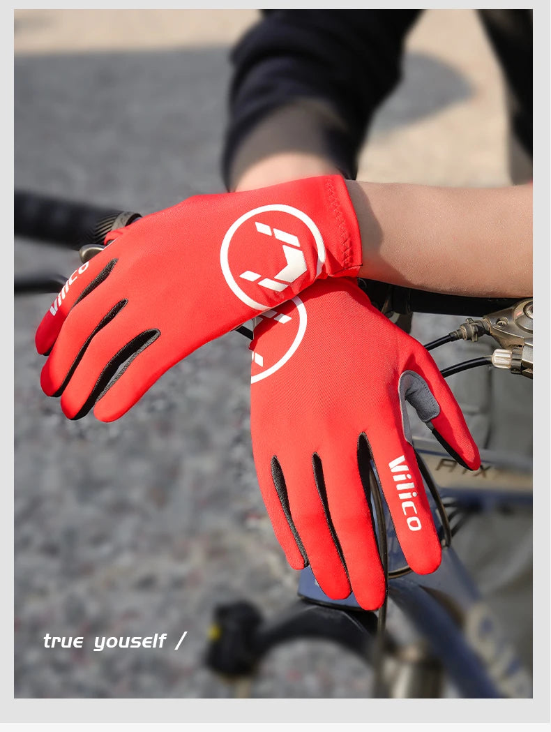 A close-up of a red performance cycling glove with a white logo on a hand gripping a bicycle handlebar.