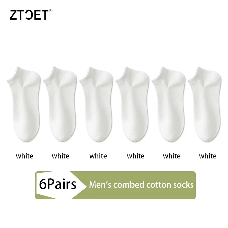 Six pairs of white men's combed cotton socks displayed side by side.