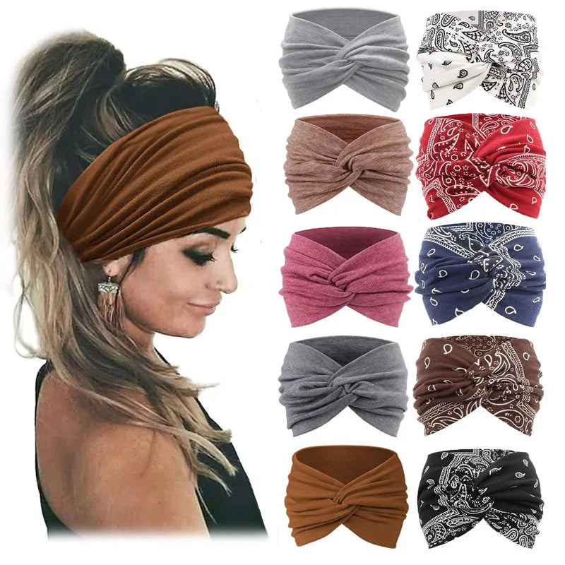 Colección de diademas de tela marrón, gris, rosa y roja atadas en lazos para fitness y yoga.