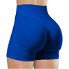 A close-up view of royal blue high-waisted yoga shorts worn by a person.