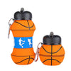 An orange foldable silicone sports water bottle with a black cap and carabiner clip.