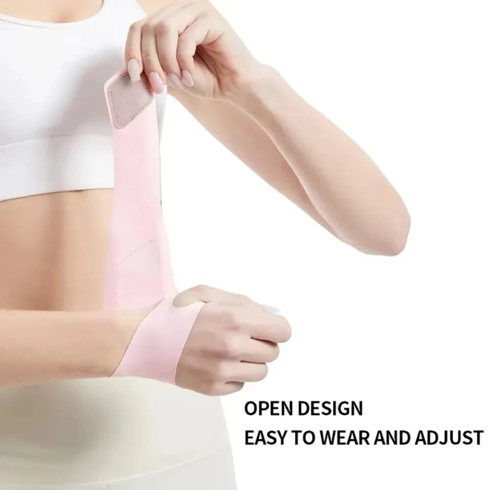 A person is wearing a pink breathable wrist guard for sports and fitness.